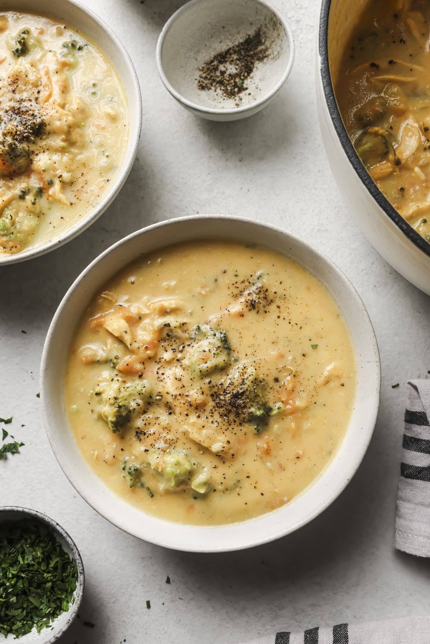 two bowls of healthy broccoli cheddar soup. 
